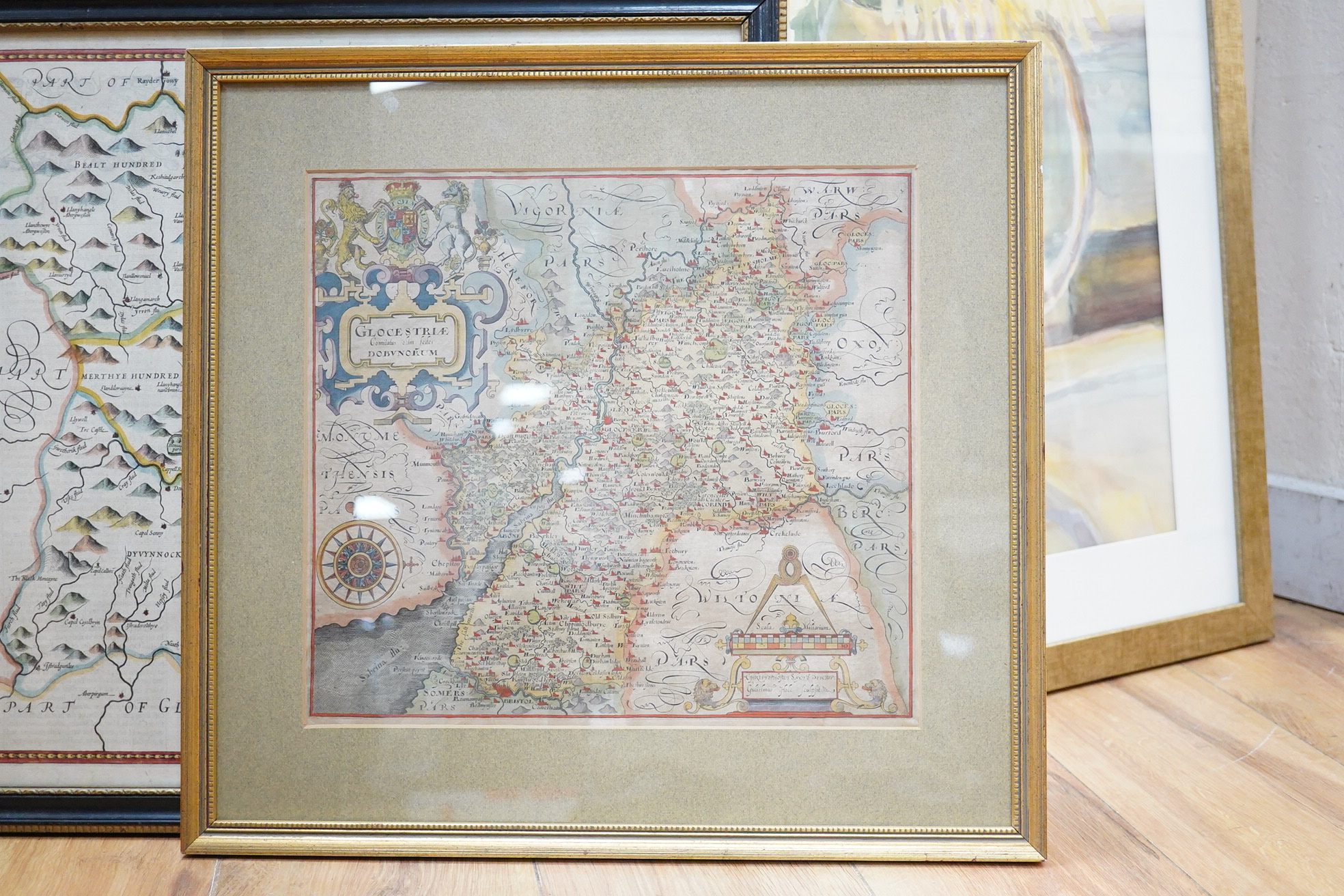 Two framed 17th and 18th century maps; a John Speede map of Breknoke, together with a William Hole map of Gloucestershire, larger 41 x 53cm